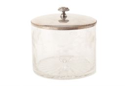 AN ENGRAVED GLASS AND SILVER PLATED BISCUIT BOX