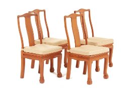 A SET OF FOUR THAI CARVED TEAK CHAIRS