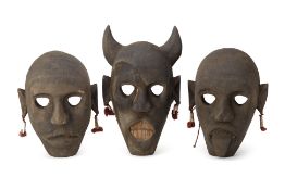 A SET OF THREE CARVED WOOD MASKS