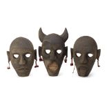 A SET OF THREE CARVED WOOD MASKS