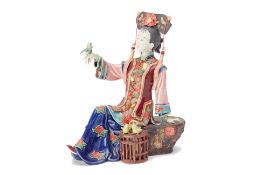 A CHINESE PORCELAIN FIGURE OF A LADY