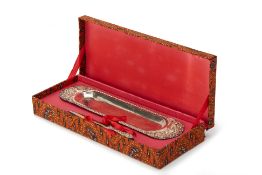 AN INDONESIAN SILVER LETTER OPENER AND PEN TRAY