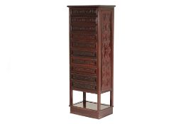 A TALL CHINESE CARVED HARDWOOD CHEST OF DRAWERS