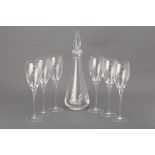 A SET OF SIX LA REINE GLASS FLUTES AND A DECANTER