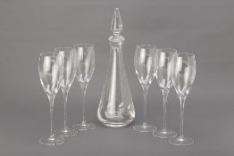 A SET OF SIX LA REINE GLASS FLUTES AND A DECANTER