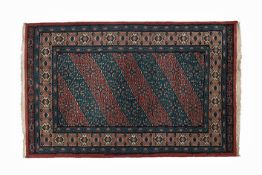 AN ORIENTAL RUG