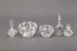 A GROUP OF GLASS SCENT BOTTLES AND CANDLE HOLDERS