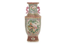 A LARGE TWIN HANDLED FAMILLE ROSE PORCELAIN VASE