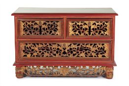 AN INDONESIAN CARVED AND PARCEL GILT SMALL CHEST / CABINET