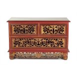 AN INDONESIAN CARVED AND PARCEL GILT SMALL CHEST / CABINET