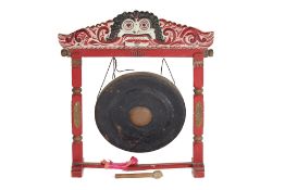 A LARGE CARVED AND PAINTED WOOD GONG