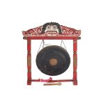 A LARGE CARVED AND PAINTED WOOD GONG