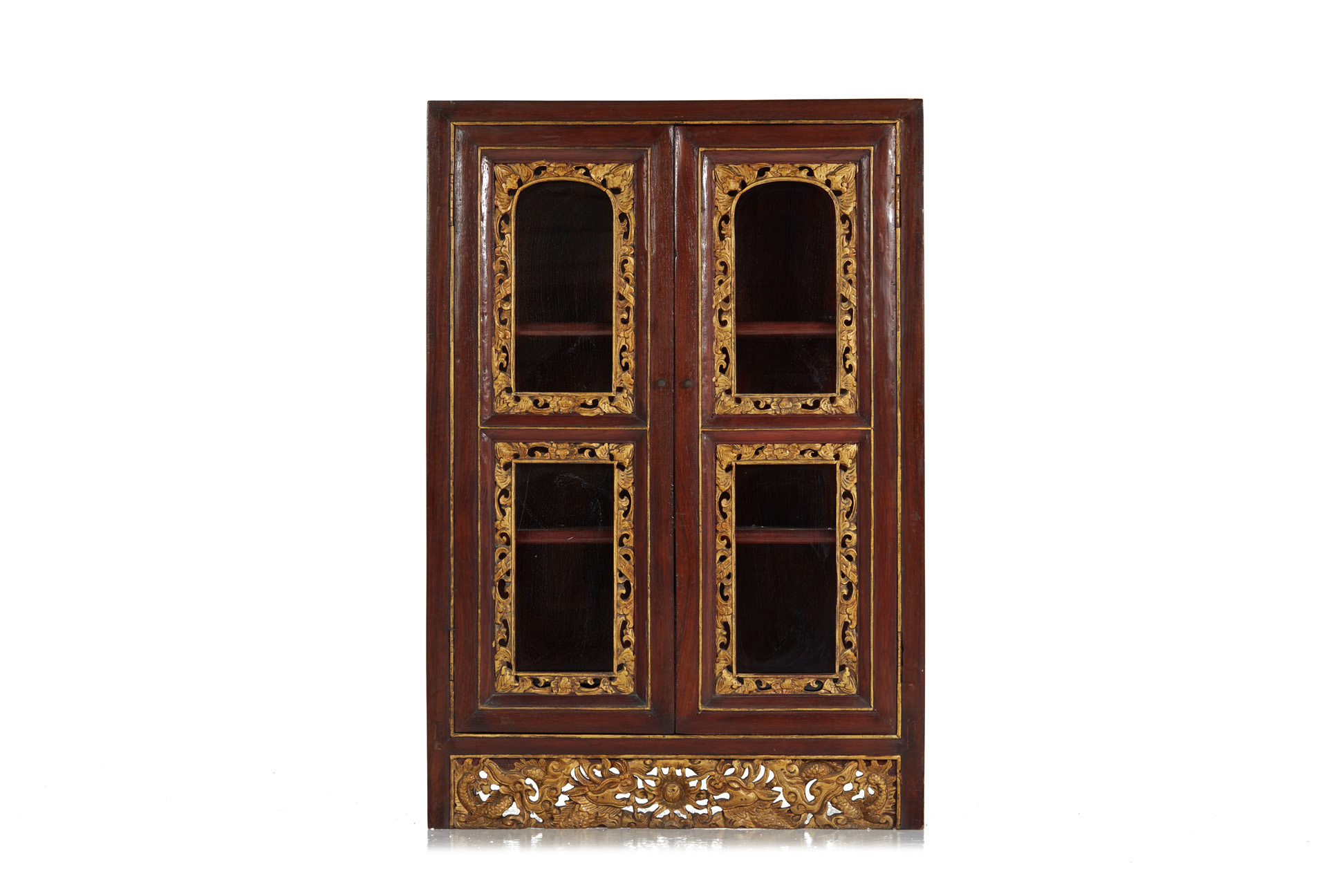 A SMALL CARVED AND PARCEL GILT GLAZED DISPLAY CABINET
