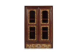 A SMALL CARVED AND PARCEL GILT GLAZED DISPLAY CABINET