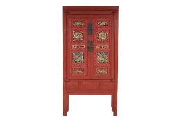 A PERANAKAN RED AND PARCEL GILT CABINET