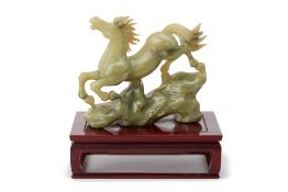 A CARVED JADE MODEL OF A HORSE