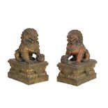 A PAIR OF CAST METAL FOO DOGS