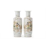 AN OPPOSING PAIR OF FAMILLE ROSE PORCELAIN ROULEAU VASES