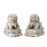 A PAIR OF CARVED SOAPSTONE FOO DOGS