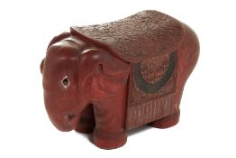 A CARVED CINNABAR LACQUER ELEPHANT STOOL