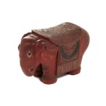 A CARVED CINNABAR LACQUER ELEPHANT STOOL