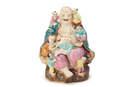 A FAMILLE ROSE PORCELAIN MODEL OF BUDAI