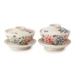 A PAIR OF PORCELAIN BOWLS, COVERS AND STANDS