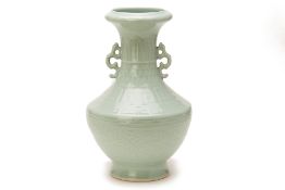 A TWIN HANDLED CELADON VASE