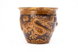 A CHINESE GLAZED DRAGON POT