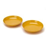 A PAIR OF MONOCHROME YELLOW GLAZED PORCELAIN DISHES