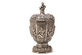 A LARGE BURMESE SILVER VASE AND COVER