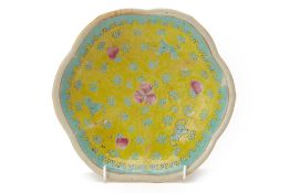 A YELLOW AND TURQUOISE GROUND FOOTED DISH