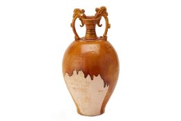 AN OCHRE-GLAZED OVIFORM AMPHORA