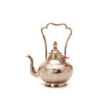 AN ORIENTAL WHITE METAL TEAPOT