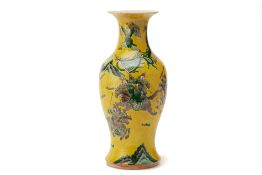 A YELLOW GROUND FAMILLE VERTE BALUSTER VASE