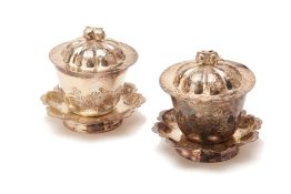 A PAIR OF CHINESE WHITE METAL TEA BOWLS, COVERS AND STANDS