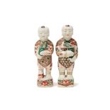 TWO SIMILAR FAMILLE VERTE PORCELAIN FIGURES OF BOYS