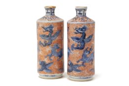 A PAIR OF SMALL UNDERGLAZE BLUE AND IRON RED VASES