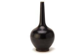 A BLACK GLAZED PORCELAIN BOTTLE VASE