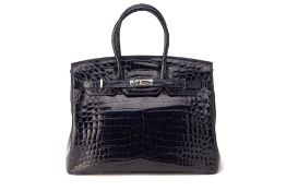 A KWANPEN NAVY PATENT CROCODILE TOP HANDLE HANDBAG