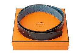 AN HERMES REVERSIBLE BLUE AND BLACK LEATHER BELT STRAP