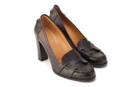 A PAIR OF HERMES BLACK LEATHER 'NIELS' LOAFER HEELS EU 39.5