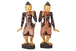 A PAIR OF LARGE BURMESE CARVED AND PAINTED WOOD FIGURES