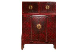 A VERY LARGE CHINESE RED LACQUERED COMPOUND CABINET