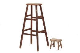 TWO WOODEN STOOLS OF TAPERING FORM