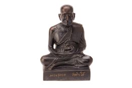 A THAI BRONZE FIGURE OF A MONK