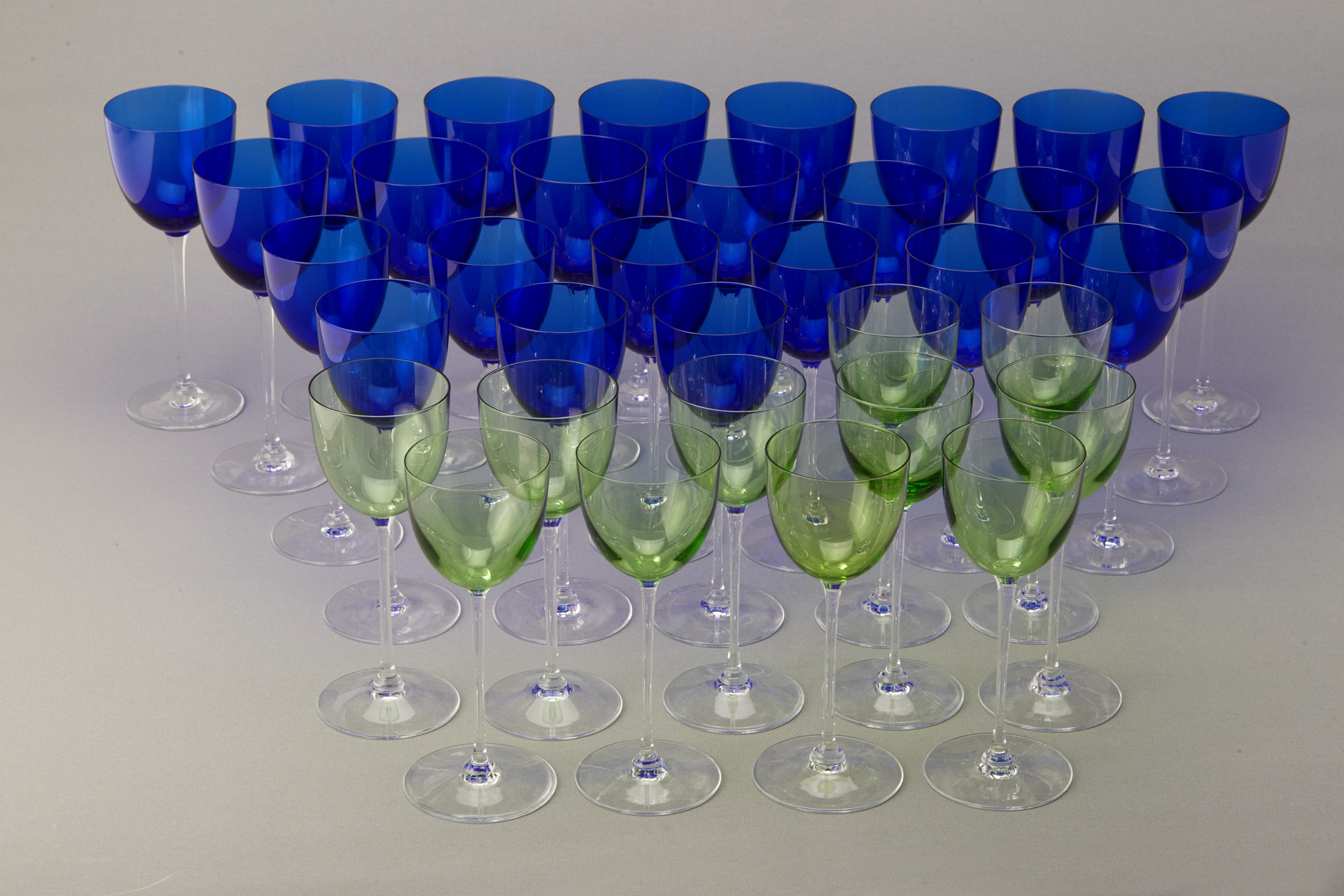A SUITE OF FRENCH BLUE AND GREEN WINE GLASSES