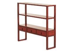 A BURGUNDY RED LACQUER BOOKSHELF