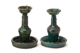 A PAIR OF CHINESE GREEN GLAZED POTTERY CANDLESTICKS