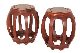 A PAIR OF CHINESE BARREL FORM WOOD STOOLS